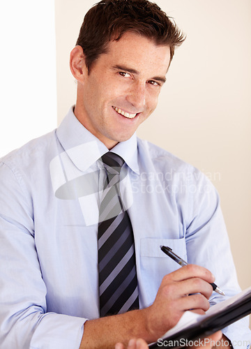 Image of Business man, writing and documents in portrait, ideas and notes with smile, schedule or signature in workplace. Entrepreneur, accountant and paperwork with pen, brainstorming and checklist in office