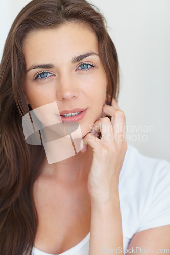 Image of Woman, portrait and serious in studio with beauty, cosmetics treatment and glowing skin on white background. Person, model and face with pride or calm for skincare and dermatology with confidence