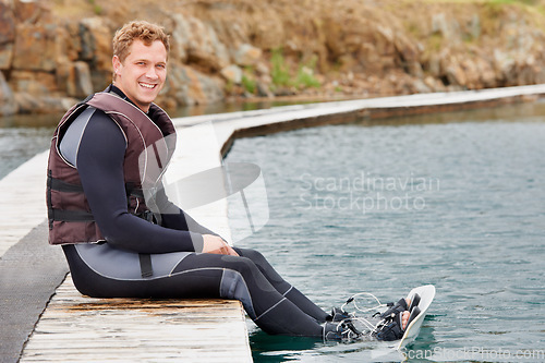 Image of Sports, lake and portrait of man with wakeboard for surfing, exercise and recreation hobby outdoors. Fitness, extreme sport and person with board for water skiing for freedom, adventure and fun