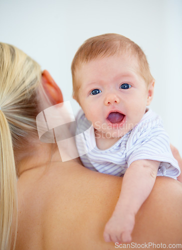 Image of Family, shoulder and portrait of baby with mother in home for bonding, relationship and love. Happy, bedroom and closeup of parent carrying newborn for child development, growth and care in nursery