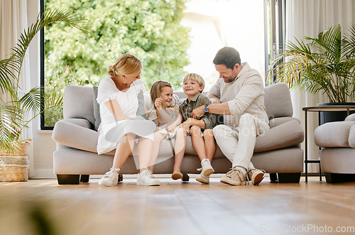 Image of Family, tickle and play on couch, laughing and bonding at home, fun and silly humor or comedy. Parents and children, connection and security in relationship, happy and care on sofa, love and goofy