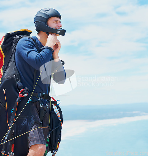 Image of Preparation, parachute or man with helmet for sport, safety or gear to exercise for health wellness. Sky mockup, equipment or fitness in nature for outdoor training, fearless or countryside adventure