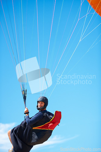 Image of Man, portrait and paragliding in blue sky parachute for adventure fun, clouds or explore city. Male person, face and outdoor courage for fearless athlete or landing equipment, air safety in nature