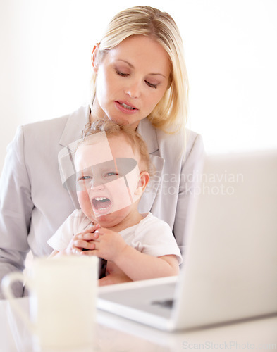 Image of Businesswoman, crying and baby for remote work in home with laptop for multitask, productivity and job. Single mom, toddler and lap for comfort, childcare or love for freelance, development woking