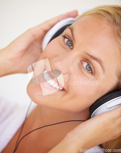 Image of Portrait, happy woman and headphones for listening to music, freedom and wireless in closeup. Female person, face and smile with excitement for technology with podcast, radio or streaming service