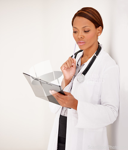 Image of Woman, doctor thinking and medical charts for hospital schedule, management or results with solution or idea. African person reading of healthcare checklist, clipboard or folder on a wall background