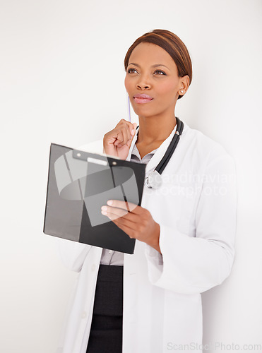 Image of Woman, doctor thinking and healthcare charts for hospital schedule, management or results with solution or ideas. African person reading of medical checklist, clipboard or folder on a wall background