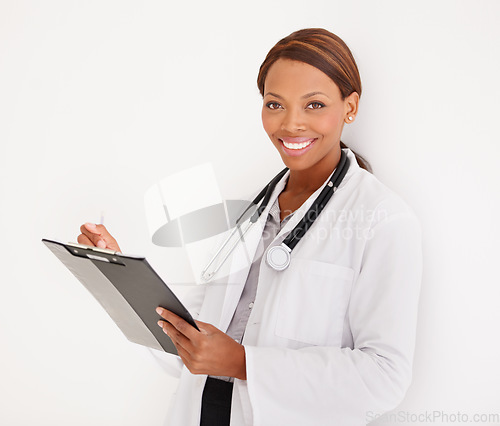 Image of Doctor portrait, woman with charts and writing of medical documents, report or information of patient history in studio. Face of healthcare worker and clinic folder or checklist on a white background