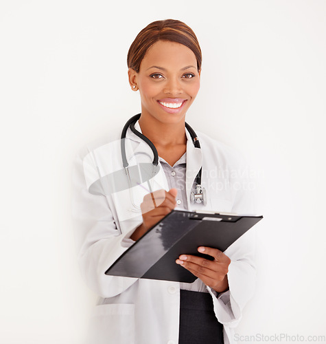 Image of Doctor portrait, woman and folder or documents for medical information, test results or evaluation in studio. Face of healthcare worker writing in charts or checklist on a wall or white background