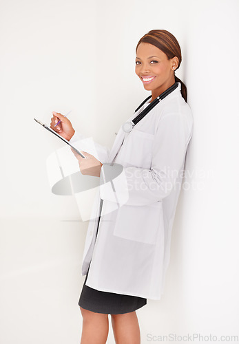Image of Doctor portrait, woman with documents and writing in medical charts, test results or health evaluation in clinic. Happy healthcare worker with hospital folder or checklist on wall or white background