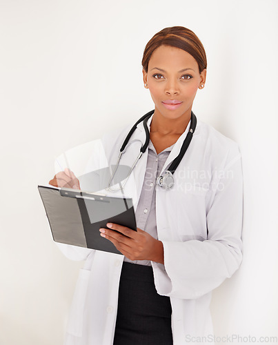 Image of Doctor portrait, woman and charts or documents for medical information, test results or evaluation in clinic. Face of african healthcare worker writing in folder on a wall or white background