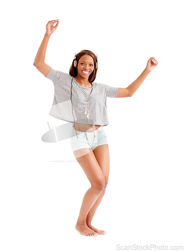 Image of Happy black woman, portrait and dancing to music on headphones isolated against a white studio background. African female person smile with headset, listening or enjoying audio streaming or podcast