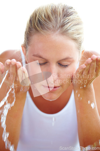 Image of Skincare, washing face and woman with water in studio for hygiene, wellness and facial treatment. Spa, dermatology and person with liquid splash for cleaning, beauty and health on white background