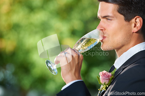 Image of Wedding, nature and groom drinking champagne for romantic celebration, party or event. Garden, alcohol and young man in a suit with sparkling wine at luxury, elegant and fancy marriage ceremony.