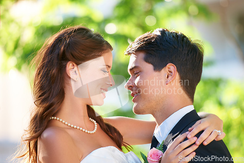Image of Happy couple, wedding and hug for love, marriage or affection together in outdoor nature. Married man and woman or newlyweds hugging, smile or support for romantic honeymoon, embrace or commitment
