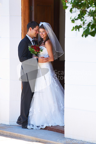 Image of Happy couple, hug and wedding for marriage, love or honeymoon suite in commitment together. Married man or groom hugging woman or bride smile for embrace, loyalty or support in trust at ceremony