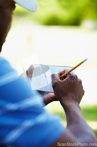 Image of Sports, golf and person with scorecard on course with sheet for playing game, practice and training. Professional golfer, grass and hands writing score on paper for winning stroke for competition