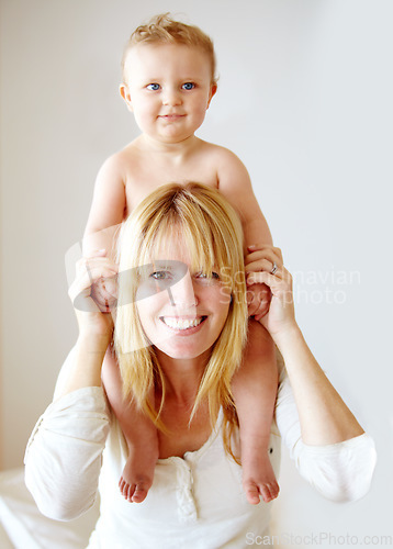 Image of Portrait, mother and carrying baby on shoulders in house bedroom for fun, games and playing. Smile, happy and woman holding toddler in trust, support and love for development, growth and family home