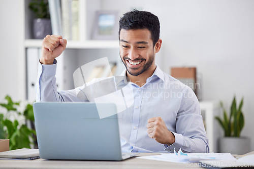 Image of Asian man, success fist and laptop by desk with happy, stock market deal and investment portfolio growth in office. Profit, winner hands and smile by computer with technology and online with cheering