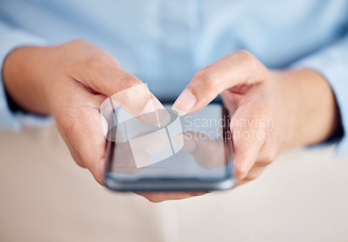Image of Business woman, phone and hands typing for communication, social media or networking at office. Closeup of female person or employee on mobile smartphone for online texting or chatting at workplace