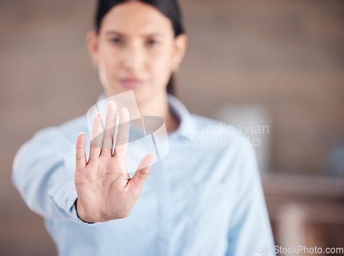 Image of Business woman, hand and stop for protest, wait or halt with no gesture or take a stand at office. Closeup of female person or employee showing palm for negative sign or disapproval at workplace