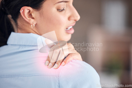 Image of Hand, injury or shoulder pain with a business woman closeup in an office with posture problems. Back, anatomy and highlight with a young employee holding a muscle or joint in a professional workplace