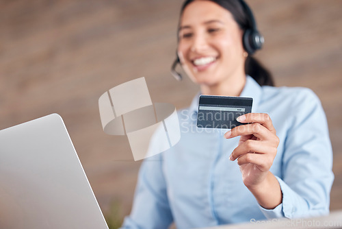 Image of Happy woman, laptop and credit card at call center for payment, customer service or ecommerce at office. Female person, consultant or business agent smile with debit for online banking and support