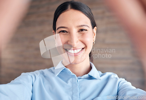 Image of Selfie, face and a business woman in her office to update her social media profile picture. Portrait, smile and a happy young employee posing for a photograph as a professional in the workplace