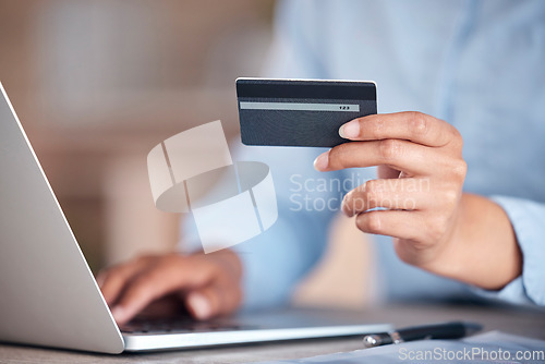 Image of Business woman, laptop and hands with credit card for payment, online shopping or banking at office. Closeup of female person or employee with debit for fintech, purchase or ecommerce at workplace