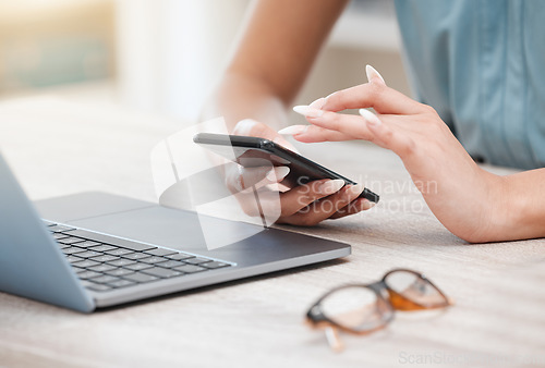 Image of Hands, phone and a business woman at a desk in her office for communication, networking or search. Laptop, planning and glasses with an employee typing a text message closeup in the workplace