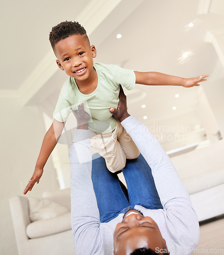 Image of Airplane, smile and portrait of child with father in the living room of modern house having fun. Happy, love and young African boy kid playing with his dad on the floor of the lounge at home together