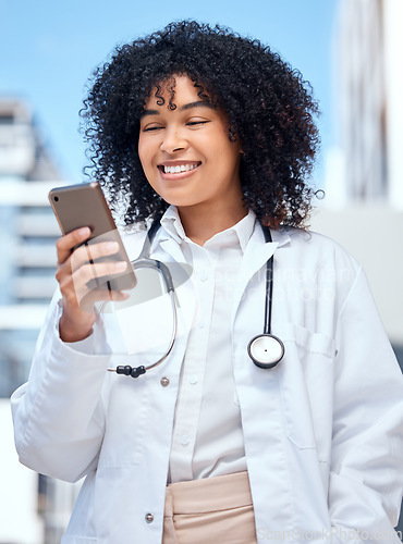 Image of Doctor, happy woman and phone for medical chat, social media and reading online information outdoor at hospital. African worker in healthcare with mobile for telehealth service, FAQ or clinic contact