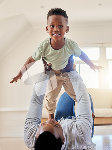 Image of Airplane, happy and portrait of child with father in the living room of modern house having fun. Smile, love and young African boy kid playing with his dad on the floor of the lounge at home together