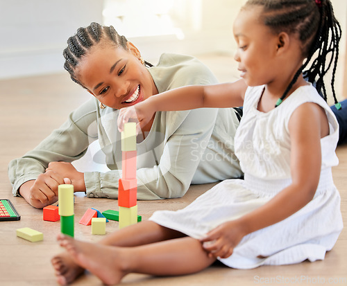 Image of Family on the floor, mother and girl with blocks, playful and fun with happiness, weekend break and relaxing. Mama, apartment and kid with child development, home and building tower with wooden toys