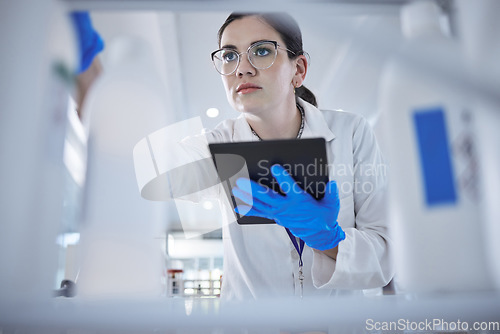 Image of Woman, medical scientist and tablet in lab for test results check, future trial or science solution. Female person, digital device and thinking or review breakthrough hope, idea in biotechnology