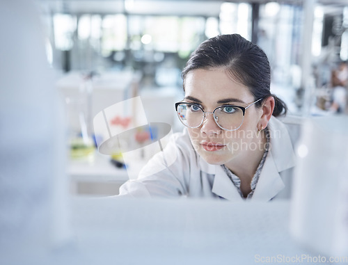 Image of Woman, medical research and lab thinking for vial discovery or future vaccine, review or health technology. Female person, glasses in study breakthrough or antibiotic, help results or innovation idea