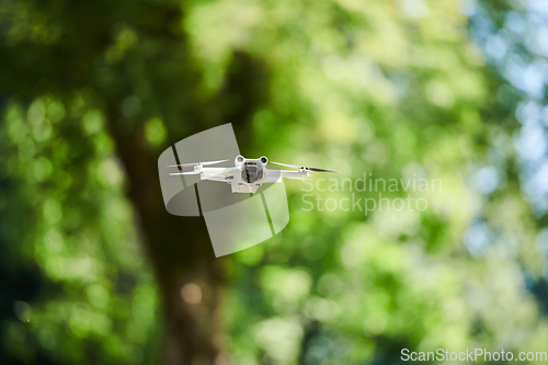 Image of Professional drone filming the park on a sunny day