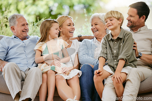 Image of Love, smile and a big family on a sofa in the living room of their home together during a visit. Happy, trust or support with young children, parents and grandparents bonding in an apartment