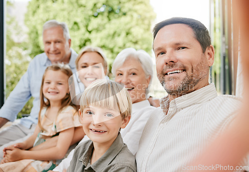 Image of Love, selfie and a big family on a sofa in the living room of their home together during a visit. Portrait, photograph or memory with happy children, parents and grandparents bonding in an apartment