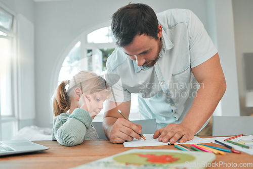 Image of Father, girl and writing in book for homework, teaching or helping child in support at home. Dad or parent drawing with little kid for learning, education or homeschooling together on table at house