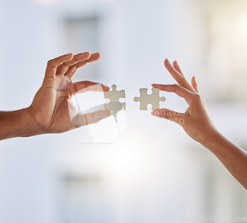 Image of People, puzzle and hands of teamwork, problem solving and planning solution for challenge, synergy or cooperation. Closeup, collaboration and build jigsaw for integration, partnership or mockup space