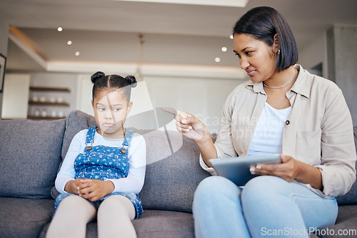 Image of Mom, child and scolding or discipline, tablet and punishment for technology. Parent and daughter, communication and disappointed for cyberbullying, bad behaviour and frustrated for digital mistake