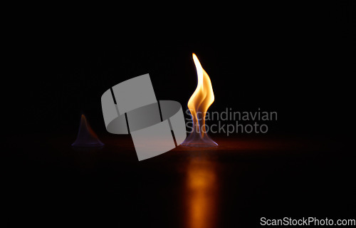 Image of Flame, heat and fire start with black background with sparks, smoke and light from burning in studio. Fuel, flare and glow from thermal power and art in the dark with creativity and inferno with burn