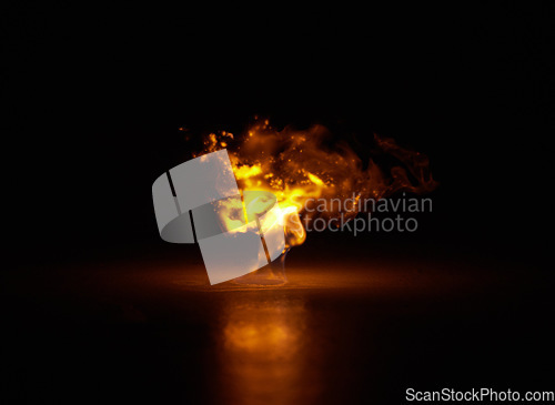 Image of Flame, heat and fire explosion with black background with sparks, gas and light from burning in studio. Fuel, flare and glow from thermal power n dark with creativity and inferno with danger
