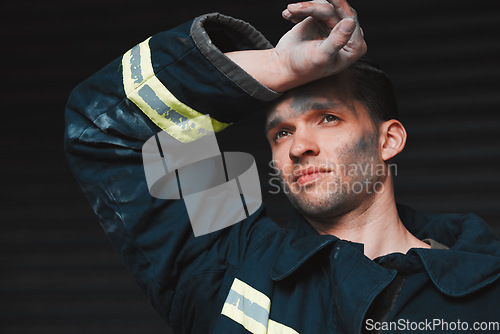 Image of Firefighter, tired and man thinking of job on a black background with fatigue. Mexican male person, exhausted and fireman with future vision for rescue trouble and stress in a professional uniform