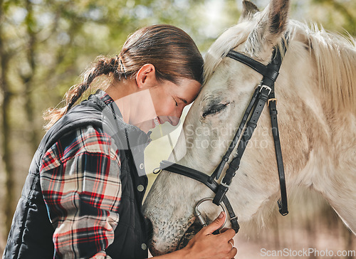 Image of Happy woman with horse in forest, embrace in nature and love for animals, pets or dressage with trees. Equestrian sport, girl jockey or rider standing in woods for adventure, hug and smile on face.