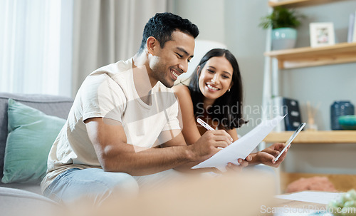 Image of Happy couple, documents and budget planning on sofa in finance, expenses or bills together at home. Man and woman smile with paperwork in living room for loan, financial plan or insurance at house