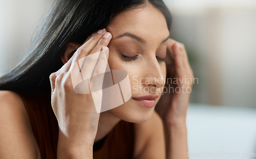 Image of Frustrated woman, headache and stress in mistake, burnout or mental health in living room at home. Closeup of female person or face with migraine, anxiety or debt in financial crisis or fail at house