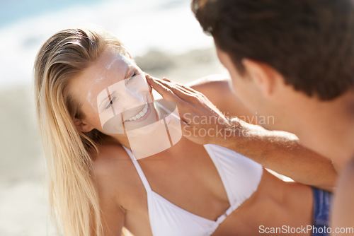 Image of Beach, couple happiness or apply sunscreen for face care hydration, wellness support lotion or UV protection. Helping happy woman, nature wife or girlfriend suncream application for skin SPF sunblock