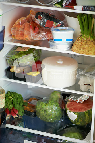 Image of Fridge, shelves and food for nutrition in health, wellness or care with grocery in kitchen. Fresh, organic and produce with greenery, vegetables and fruit for meals with vegan, vegetarian and diet